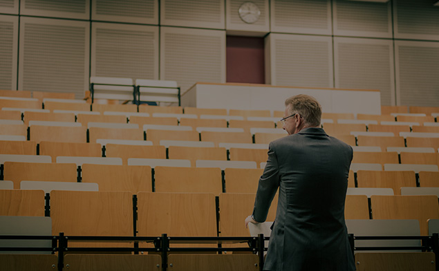 Man in empty lecture hall